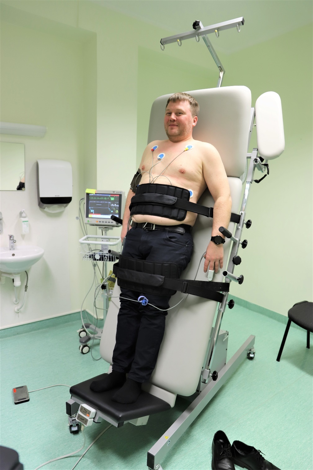 A person in a medical chair</p>
<p>Description automatically generated