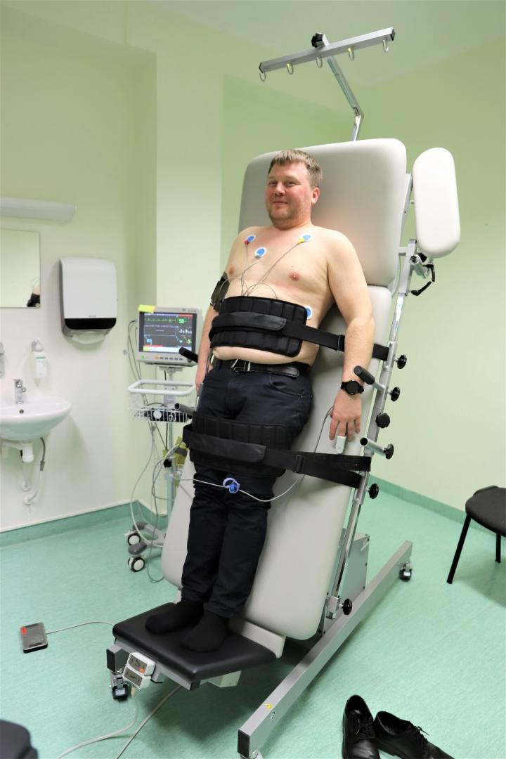 A person in a medical chair  Description automatically generated